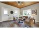Bright living room with hardwood floors, wood ceiling, neutral decor, and large windows at 222 Raines St, Plainfield, IN 46168