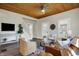 Comfortable living room featuring hardwood floors, wood ceiling, neutral decor, and stairway at 222 Raines St, Plainfield, IN 46168
