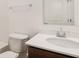Bright bathroom with a modern vanity, a white countertop, and a large mirror at 2249 Aviary Ln, Danville, IN 46122