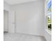Bedroom with neutral carpet, white walls, closet, and a sunny window at 2249 Aviary Ln, Danville, IN 46122