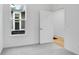 Bedroom with gray carpet, white walls, and a view of the outdoors through the window at 2249 Aviary Ln, Danville, IN 46122