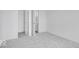 Bedroom with neutral carpet, white walls, and a walk-in closet at 2249 Aviary Ln, Danville, IN 46122