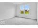 Cozy bedroom with neutral carpet, and view of the neighborhood at 2249 Aviary Ln, Danville, IN 46122
