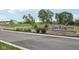 Stone entrance sign welcomes you to the Quail West community with lush landscaping and manicured lawns at 2249 Aviary Ln, Danville, IN 46122