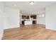 Spacious living room and kitchen combo with hardwood flooring and light fixtures at 2249 Aviary Ln, Danville, IN 46122