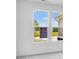 Bright room with a large window view of green fields and blue skies at 2249 Aviary Ln, Danville, IN 46122