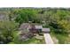 Scenic aerial shot of a charming home surrounded by mature trees and a well-manicured lawn at 2253 Mullinix Rd, Greenwood, IN 46143