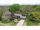 Expansive aerial view of a beautiful home nestled among mature trees and lush landscaping at 2253 Mullinix Rd, Greenwood, IN 46143