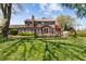 Great backyard with a deck, lovely plants, and a well-manicured lawn at 2253 Mullinix Rd, Greenwood, IN 46143