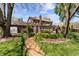 Beautiful backyard with a garden, a wooden pergola, and a brick house at 2253 Mullinix Rd, Greenwood, IN 46143