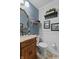 Charming powder room featuring a vanity and decorative mirror at 2253 Mullinix Rd, Greenwood, IN 46143