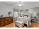 Cozy bedroom with hardwood floors, decorative wall art, and custom bedside tables at 2253 Mullinix Rd, Greenwood, IN 46143