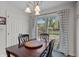 Bright dining area features wood table and sliding door leading to backyard and deck at 2253 Mullinix Rd, Greenwood, IN 46143