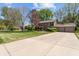 Beautiful home with well-manicured lawn and ample parking on the long driveway at 2253 Mullinix Rd, Greenwood, IN 46143
