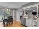 Cozy kitchen with stainless steel appliances, granite counters, and a connected dining area at 2253 Mullinix Rd, Greenwood, IN 46143