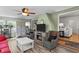 Inviting living room featuring a brick wall, fireplace, and cozy seating area at 2253 Mullinix Rd, Greenwood, IN 46143