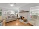 Bright living room with fireplace, hardwood floors, and open floor plan at 2253 Mullinix Rd, Greenwood, IN 46143