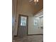 A versatile room boasts natural light, neutral walls, and durable vinyl flooring at 2253 Mullinix Rd, Greenwood, IN 46143