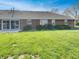 Expansive backyard with lush lawn, and sliding glass doors provide easy indoor-outdoor living at 2338 Keystone Ct, Anderson, IN 46011