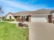 Charming front yard featuring a well-manicured lawn, and a two car garage at 2338 Keystone Ct, Anderson, IN 46011
