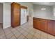Bright kitchen features ample wood cabinet storage, a refrigerator, and an island perfect for Gathering meals at 2338 Keystone Ct, Anderson, IN 46011