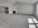 Spacious living room with neutral carpeting, a fireplace, and views to other rooms at 2338 Keystone Ct, Anderson, IN 46011