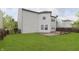 Backyard view showcasing the home's well-kept lawn and wooden deck, ideal for outdoor entertaining at 2348 Shadowbrook Dr, Plainfield, IN 46168