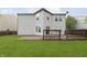 A well-maintained backyard featuring a spacious deck and a lush green lawn, perfect for outdoor enjoyment and relaxation at 2348 Shadowbrook Dr, Plainfield, IN 46168
