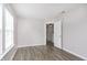 Bright bedroom with hardwood flooring, lots of light from the large window at 2348 Shadowbrook Dr, Plainfield, IN 46168