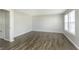 Bedroom features light gray walls, light wood floor, and large windows at 2348 Shadowbrook Dr, Plainfield, IN 46168