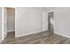Bedroom featuring hardwood flooring, several doors, and neutral walls at 2348 Shadowbrook Dr, Plainfield, IN 46168