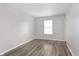 Bedroom featuring neutral walls, one window, and wood-look floors at 2348 Shadowbrook Dr, Plainfield, IN 46168