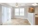 Bright dining area features sliding glass door, two windows, and ceiling fan at 2348 Shadowbrook Dr, Plainfield, IN 46168