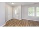 Bright entryway featuring wood floors, a closet, and natural light from the window at 2348 Shadowbrook Dr, Plainfield, IN 46168