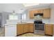 Kitchen features stainless steel appliances, light wood cabinets, and tile backsplash at 2348 Shadowbrook Dr, Plainfield, IN 46168