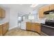 Kitchen features stainless steel appliances, light wood cabinets, and tile backsplash at 2348 Shadowbrook Dr, Plainfield, IN 46168