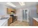 Kitchen featuring stainless steel appliances, light wood cabinets, pantry and skylight at 2348 Shadowbrook Dr, Plainfield, IN 46168