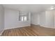 Open concept living room with wood flooring and ample natural light from the window at 2348 Shadowbrook Dr, Plainfield, IN 46168
