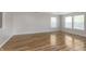 Spacious living room with wood floors and large windows filling the room with light at 2348 Shadowbrook Dr, Plainfield, IN 46168