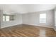 Open living room featuring wood floors, neutral walls, and bright windows at 2348 Shadowbrook Dr, Plainfield, IN 46168