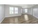 Living room features three large windows and light gray walls at 2348 Shadowbrook Dr, Plainfield, IN 46168