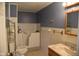 Accessible bathroom featuring a walk-in shower and safety grab bars at 2726 S Roena St, Indianapolis, IN 46241