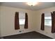 Comfortable bedroom offering two windows with blinds and neutral-colored walls at 2726 S Roena St, Indianapolis, IN 46241