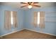 Cozy bedroom with two windows for lots of natural light and carpeted floors at 2726 S Roena St, Indianapolis, IN 46241