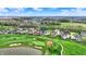 Overhead shot of houses near a golf course, highlighting manicured lawns and green fairways at 284 Chatham Hills Blvd, Westfield, IN 46074