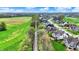 A vibrant neighborhood showcases meticulously maintained homes and lush green lawns along a tree lined street at 284 Chatham Hills Blvd, Westfield, IN 46074