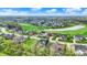 Wide aerial view of neighborhood on golf course with mature trees and pond at 284 Chatham Hills Blvd, Westfield, IN 46074