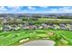 Aerial shot of luxury residences near a lush golf course, sandy bunkers and tranquil water features at 284 Chatham Hills Blvd, Westfield, IN 46074