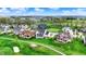 Aerial view of golf course homes, showcasing large properties and well-kept lawns next to the green at 284 Chatham Hills Blvd, Westfield, IN 46074