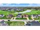 Aerial view of a luxury community with well-maintained golf course and pond at 284 Chatham Hills Blvd, Westfield, IN 46074